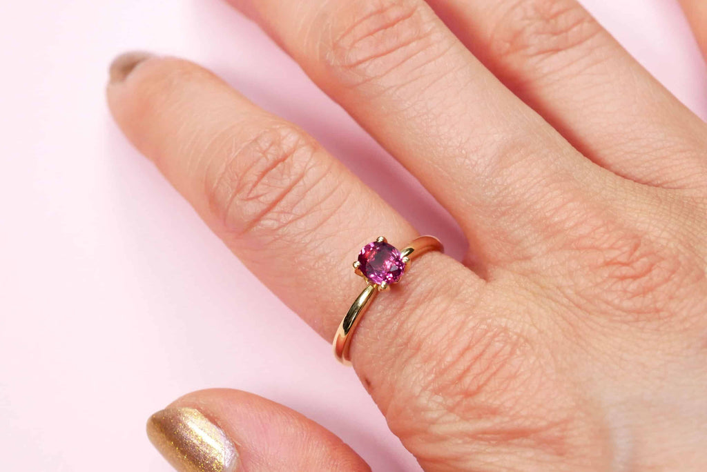 Solitaire Ring: Oval Raspberry Sapphire in 18k Yellow Gold